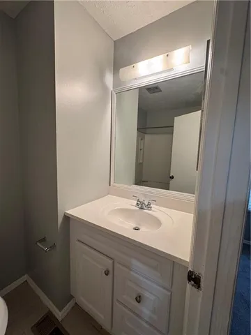 a bathroom with a sink and mirror