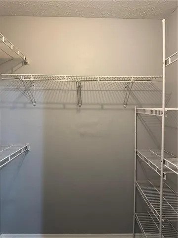 a view of a room with racks on the wall