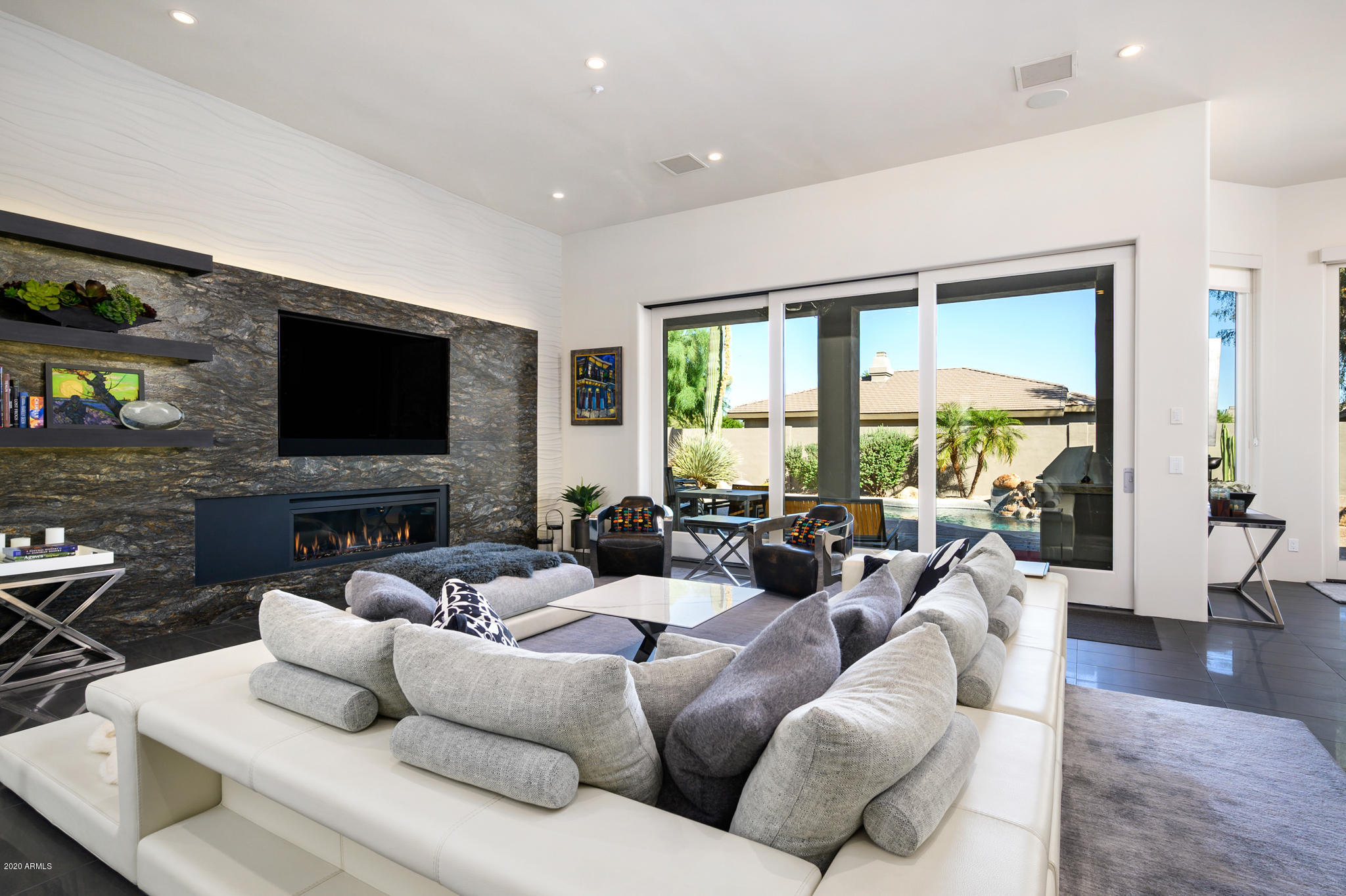 7953 East Thunderhawk Road Scottsdale, AZ 85255 - Photo 14 of 40 a living room with furniture and a flat screen tv