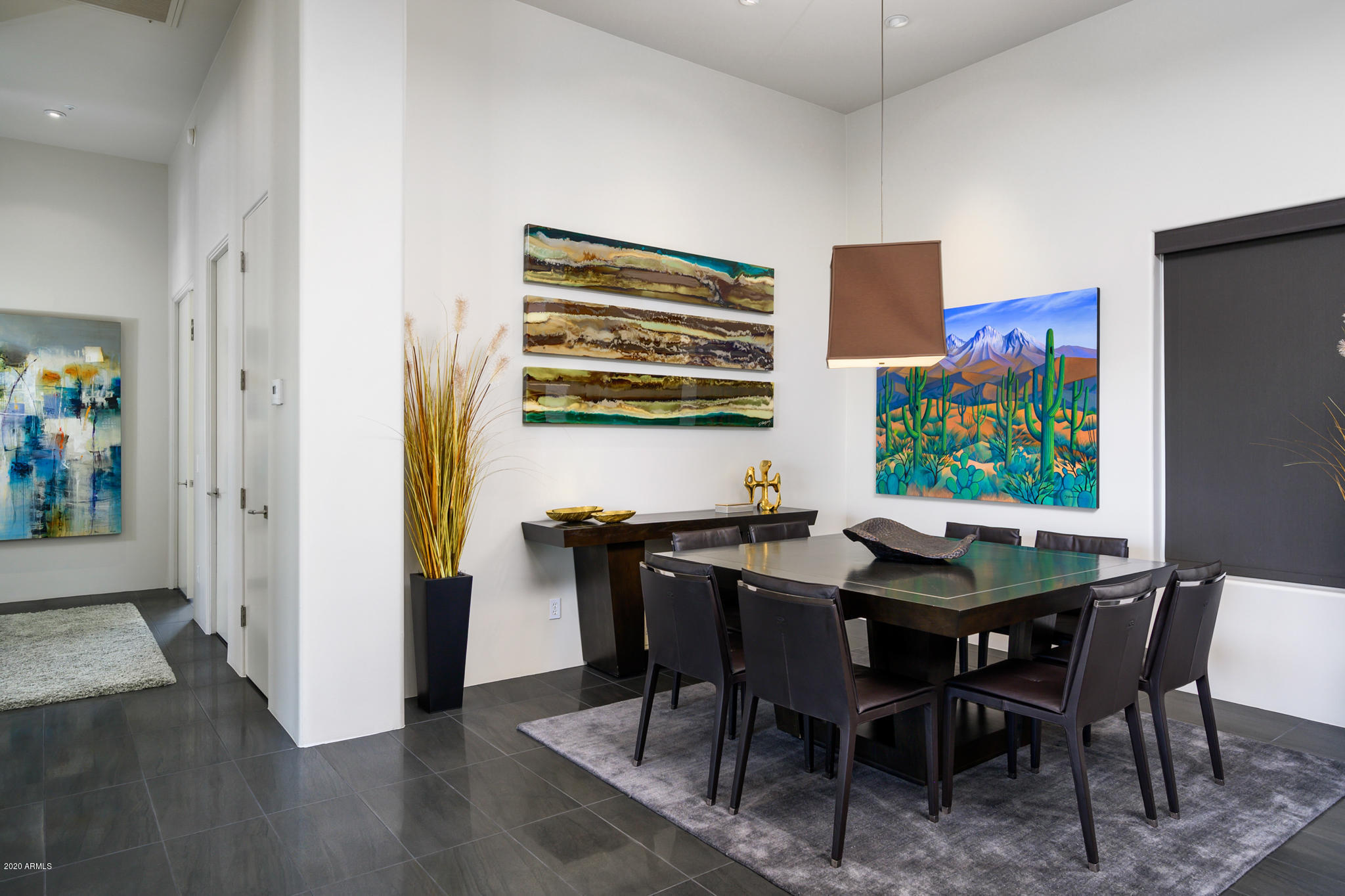 7953 East Thunderhawk Road Scottsdale, AZ 85255 - Photo 18 of 40 a view of a dining room with furniture and wooden floor