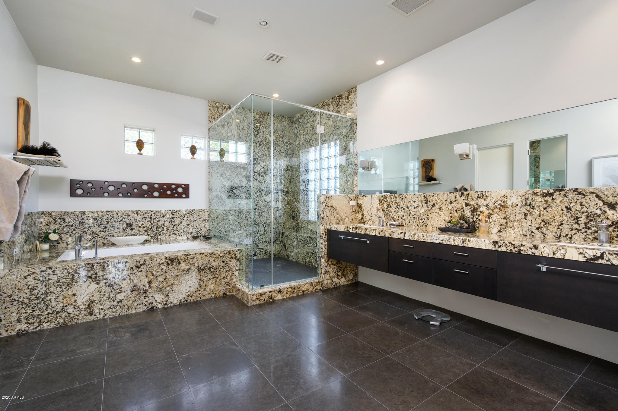 7953 East Thunderhawk Road Scottsdale, AZ 85255 - Photo 21 of 40 a bathroom with a double vanity sink and bathtub