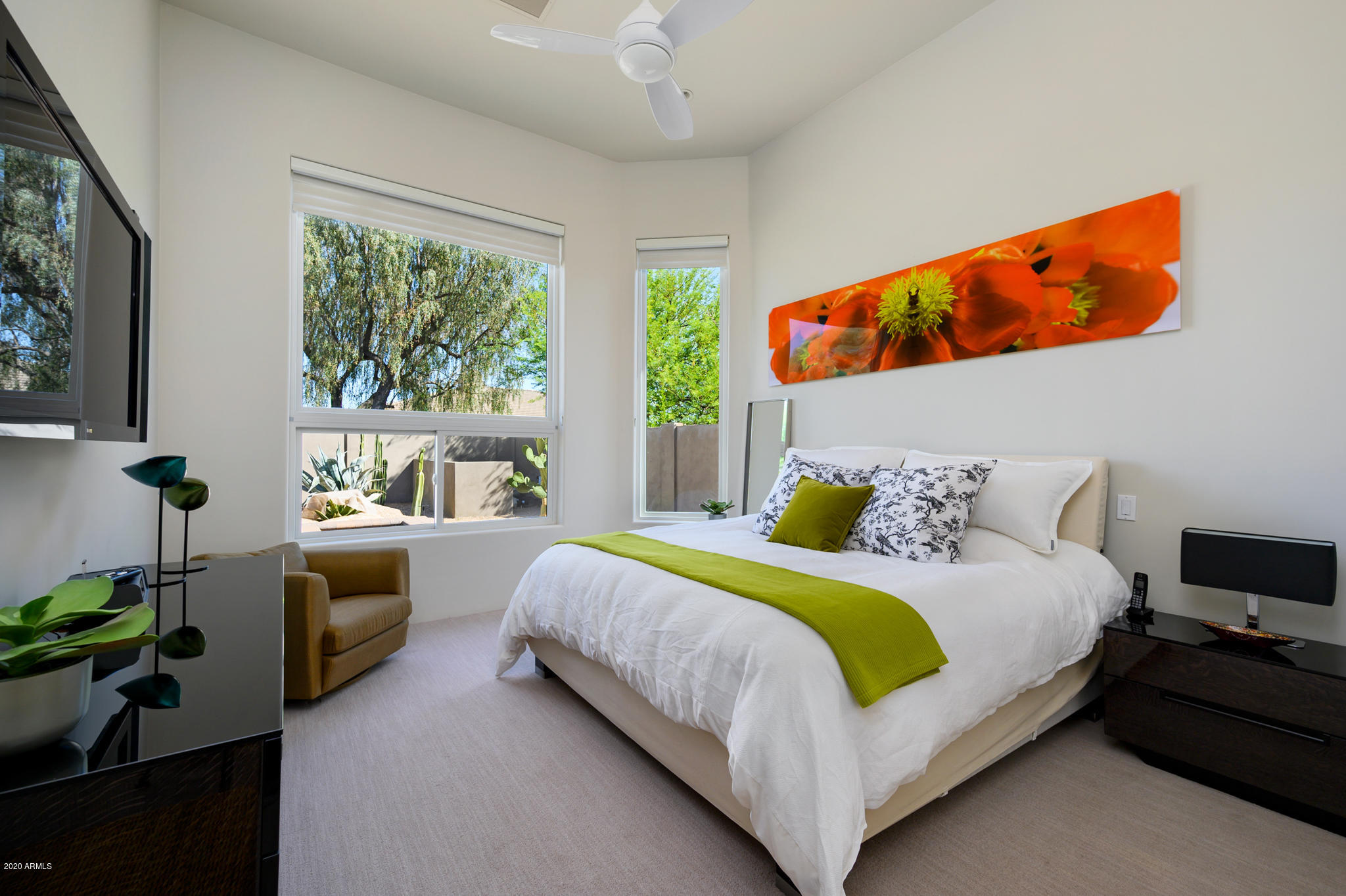 7953 East Thunderhawk Road Scottsdale, AZ 85255 - Photo 24 of 40 a bedroom with a bed and a window