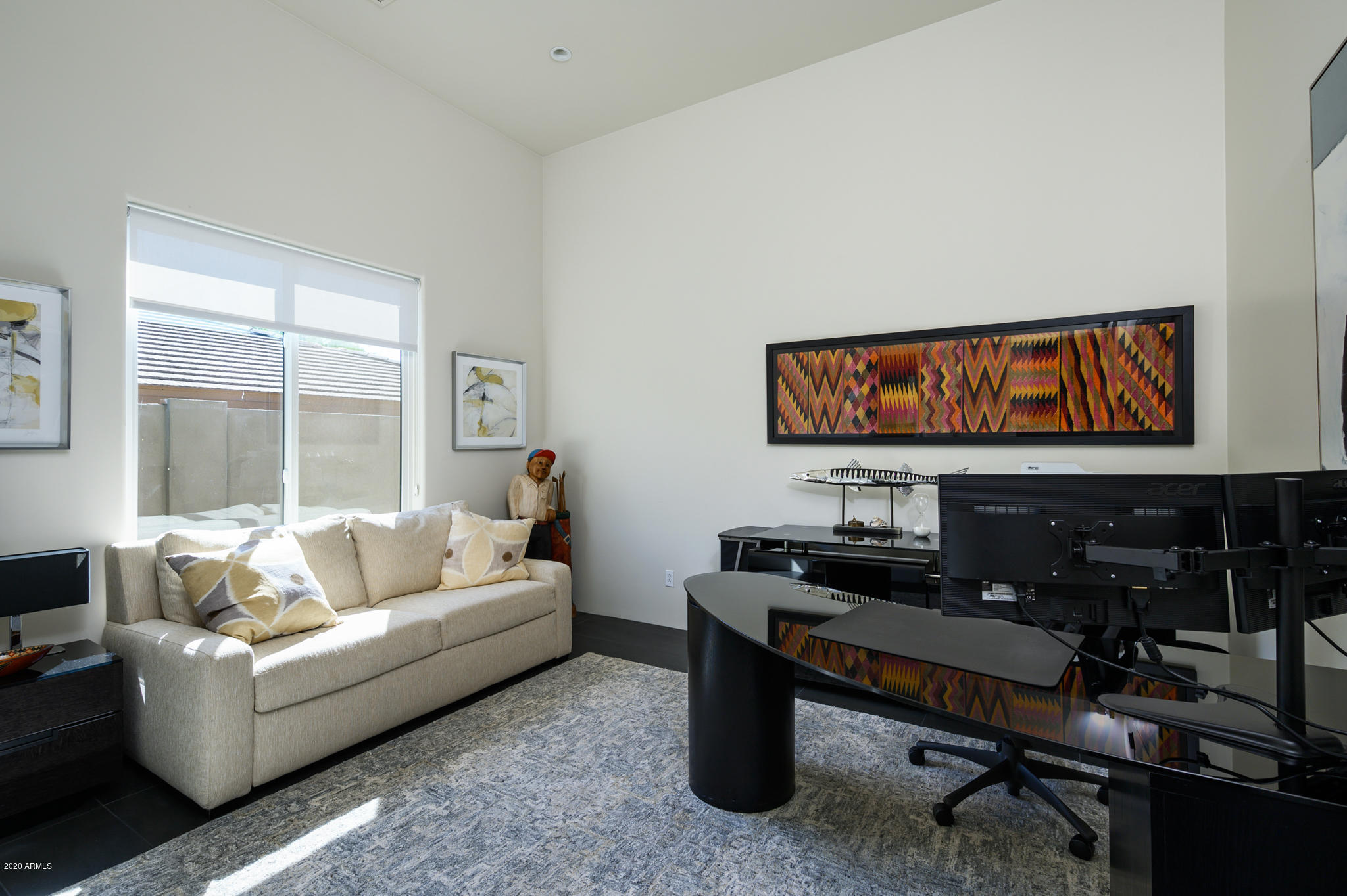 7953 East Thunderhawk Road Scottsdale, AZ 85255 - Photo 26 of 40 a living room with furniture a rug and a window