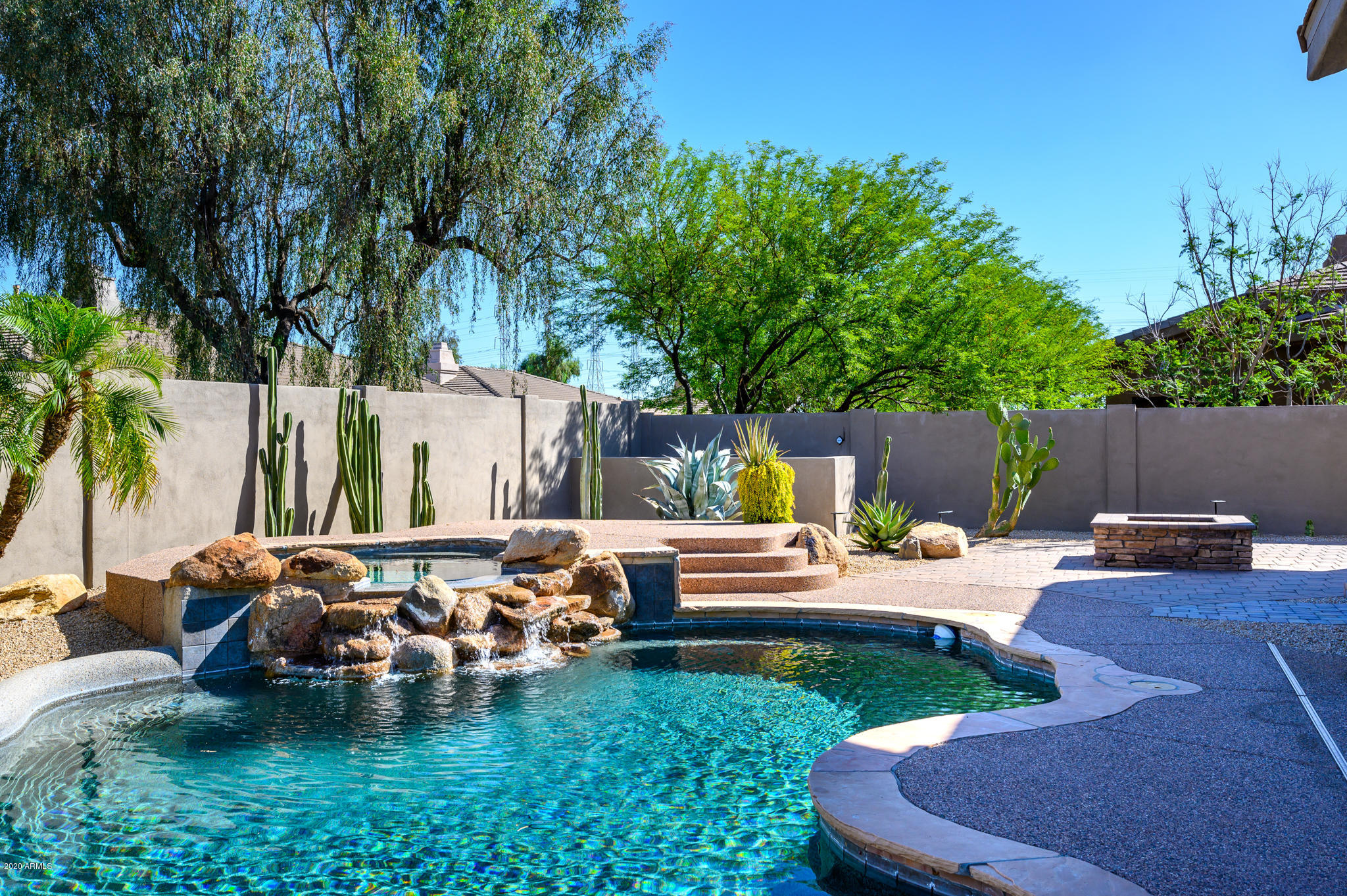 7953 East Thunderhawk Road Scottsdale, AZ 85255 - Photo 3 of 40 a view of a backyard with sitting area