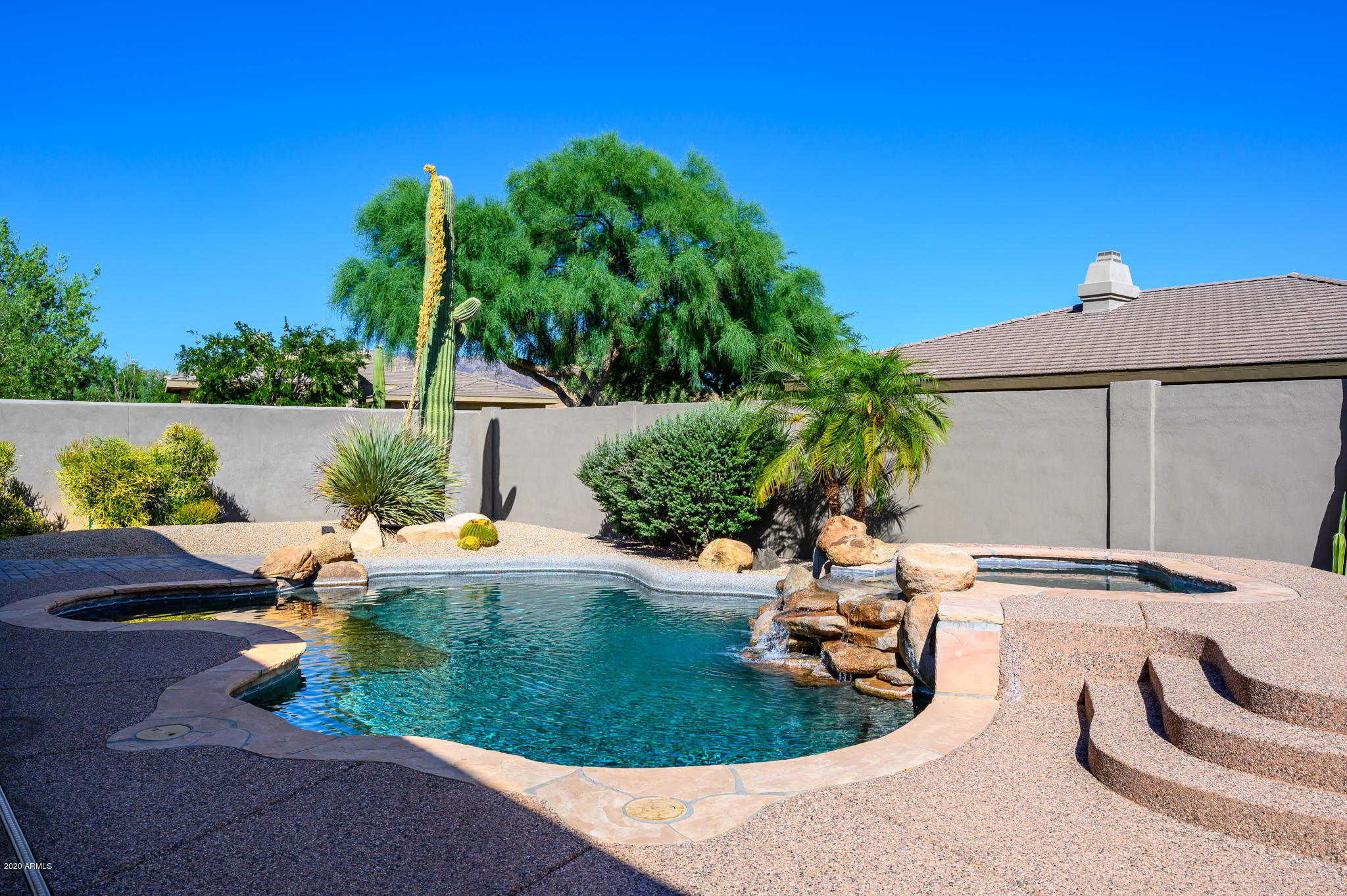 7953 East Thunderhawk Road Scottsdale, AZ 85255 - Photo 31 of 40 a backyard of a house with outdoor seating
