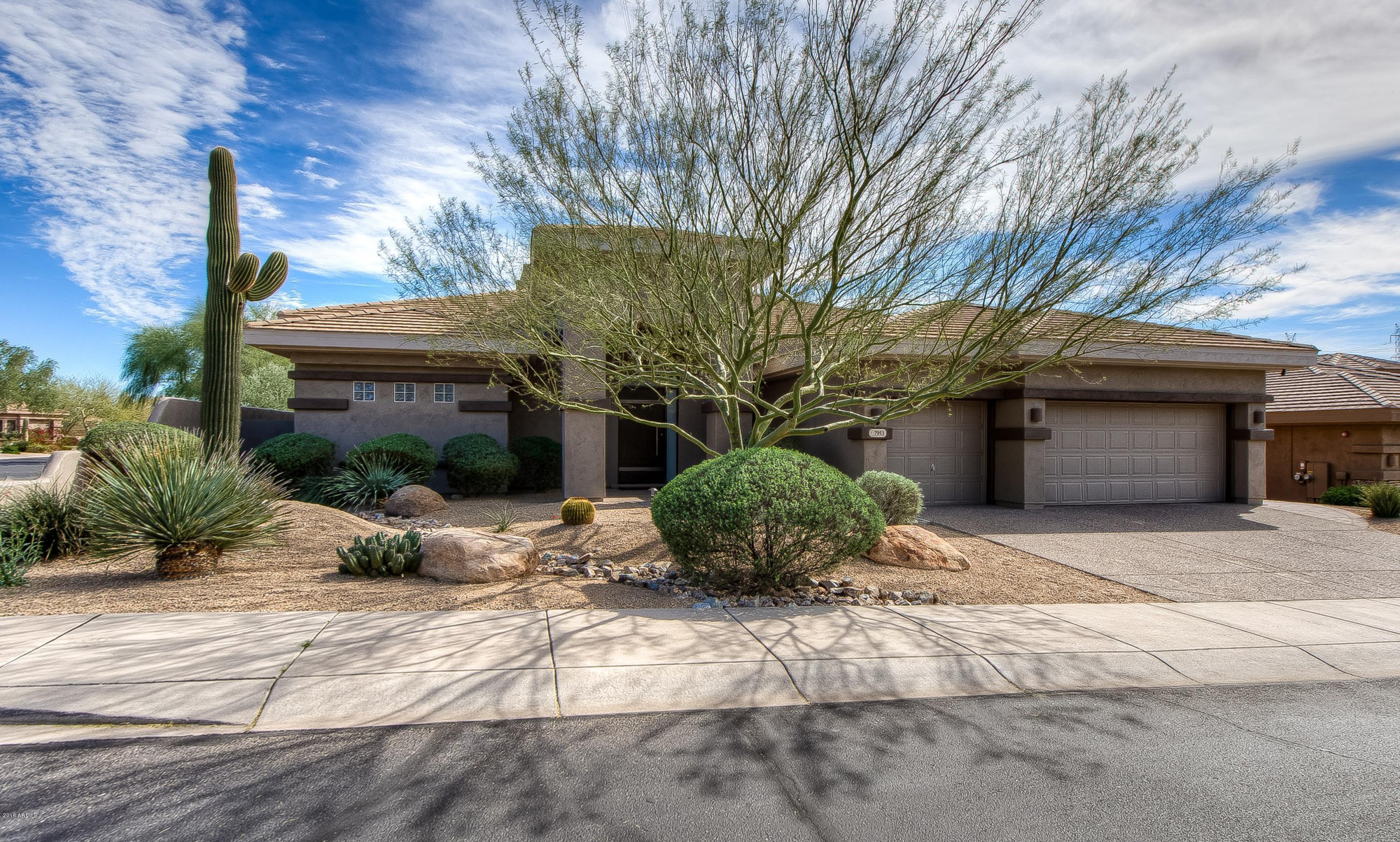 7953 East Thunderhawk Road Scottsdale, AZ 85255 - Photo 38 of 40 a front view of a house with garden