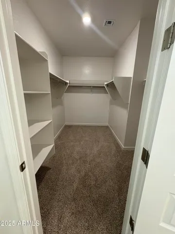 a view of an empty walk in closet