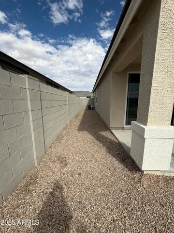 a view of a backyard of the house
