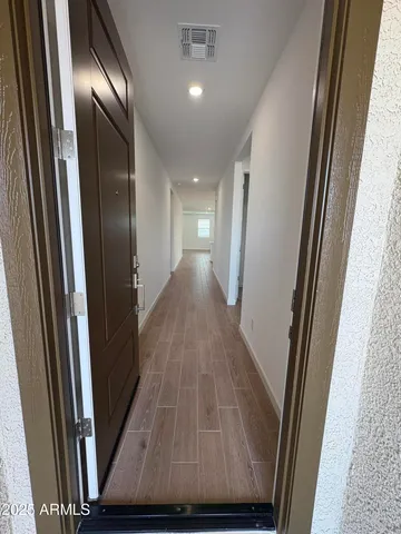 a view of gallery with wooden floor