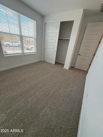 a view of empty room with windows