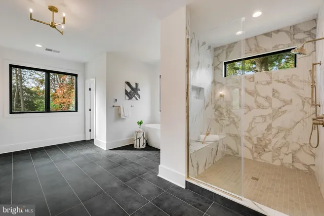 a white bath tub sitting next to a window