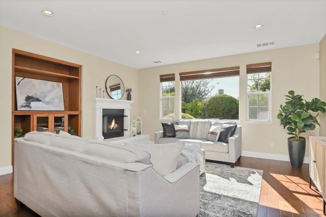 a view of staircase with wooden floor and a rug