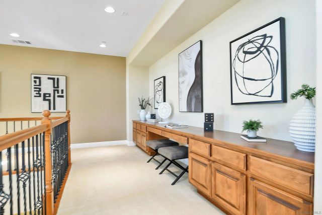 a view of a porch with chairs and backyard
