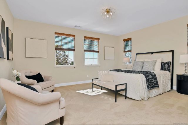 a bedroom with a bed and a tv