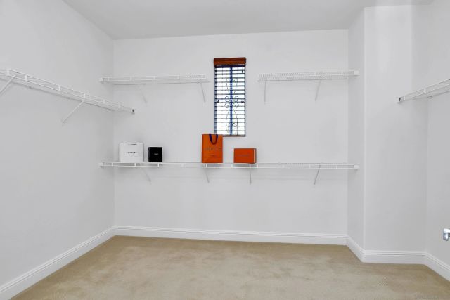 a view of a patio with table and chairs and potted plants