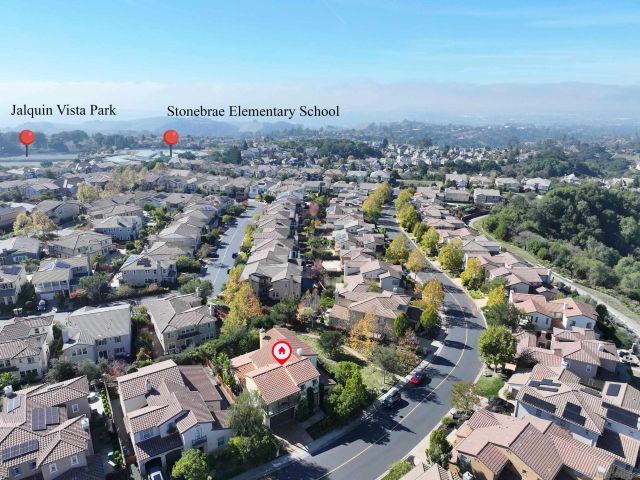 a view of a hallway with wooden floor windows and livingroom