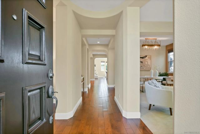 a living room with furniture flowerpot and a potted plant