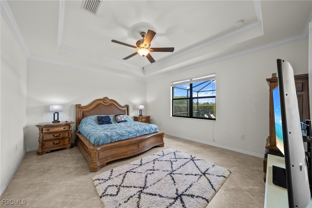 10061 Avalon Lake Circle, Unit 104 Fort Myers, FL 33913 - Photo 20 of 46 a bedroom with a bed and a window