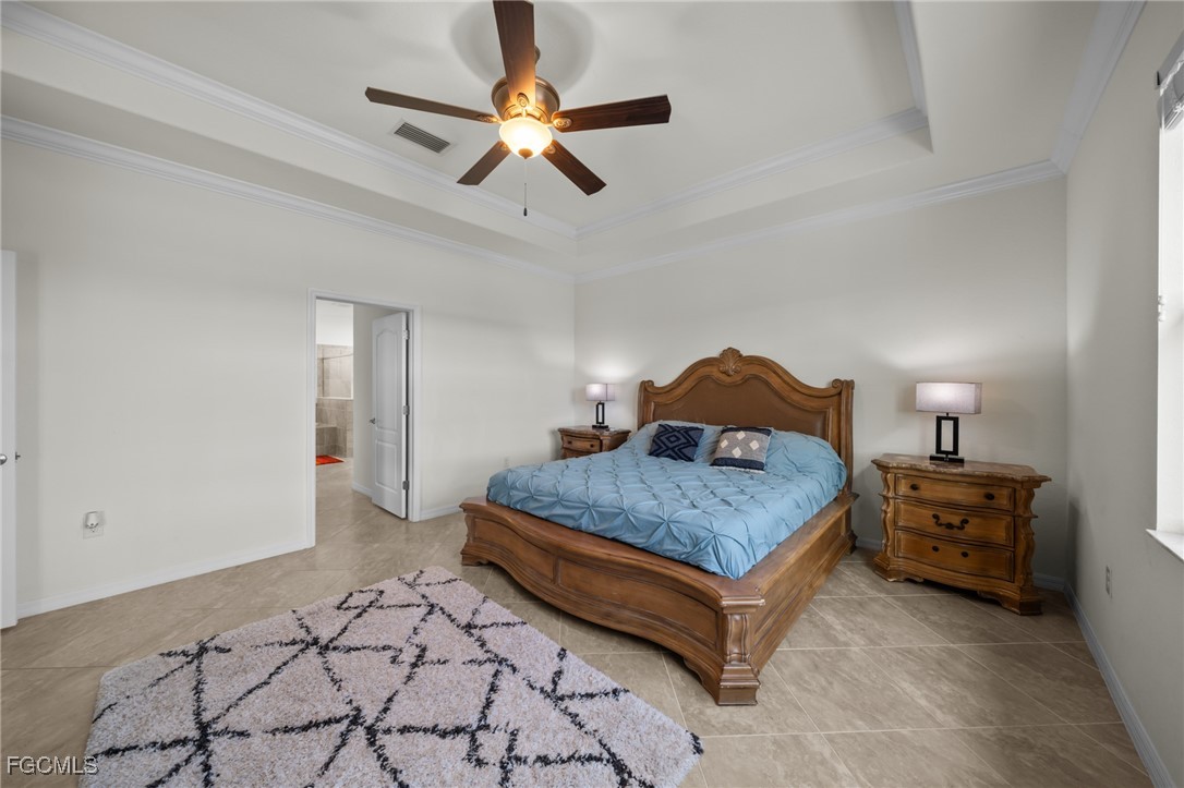 10061 Avalon Lake Circle, Unit 104 Fort Myers, FL 33913 - Photo 21 of 46 a bedroom with a bed dresser and a window