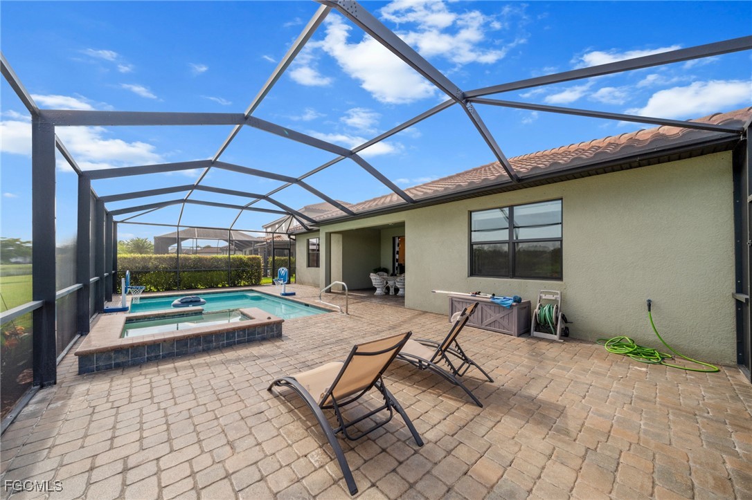 10061 Avalon Lake Circle, Unit 104 Fort Myers, FL 33913 - Photo 36 of 46 a building outdoor space with patio furniture and potted plants