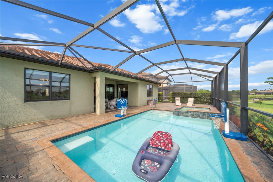 10061 Avalon Lake Circle, Unit 104 Fort Myers, FL 33913 - Photo 38 of 46 a front view of a house with garden