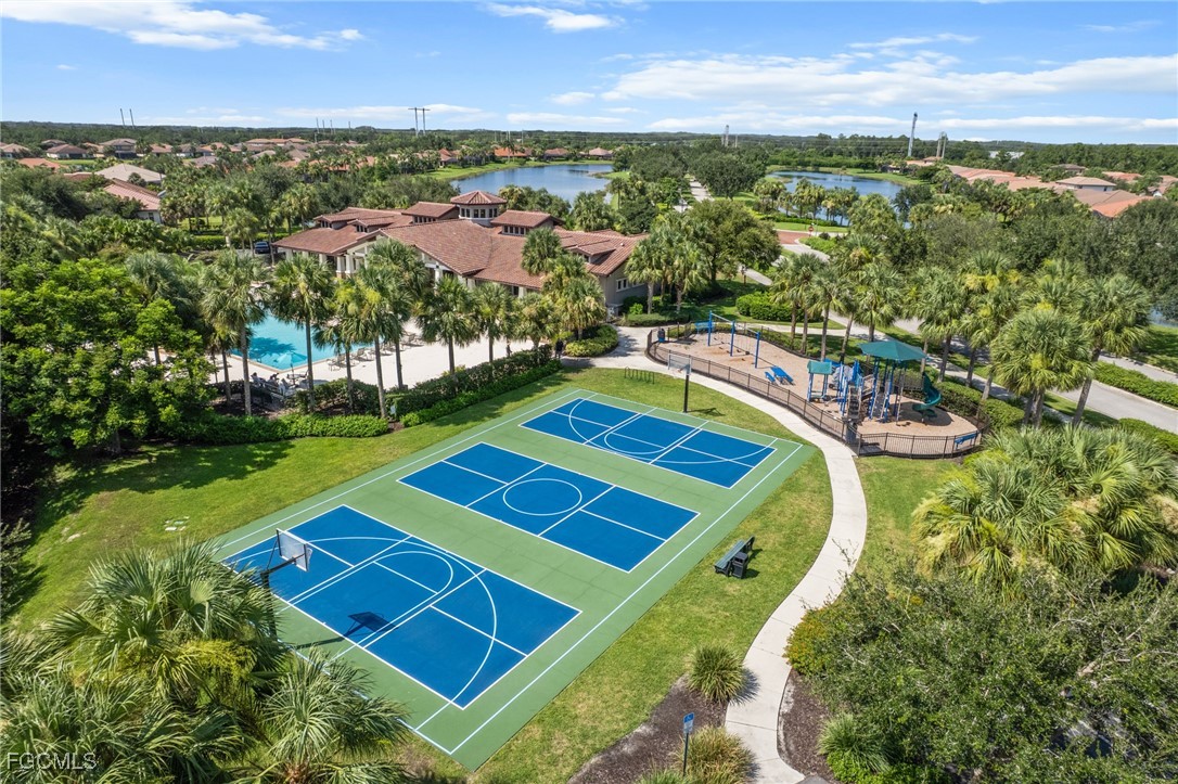10061 Avalon Lake Circle, Unit 104 Fort Myers, FL 33913 - Photo 39 of 46 an aerial view of a pool patio and mountain view