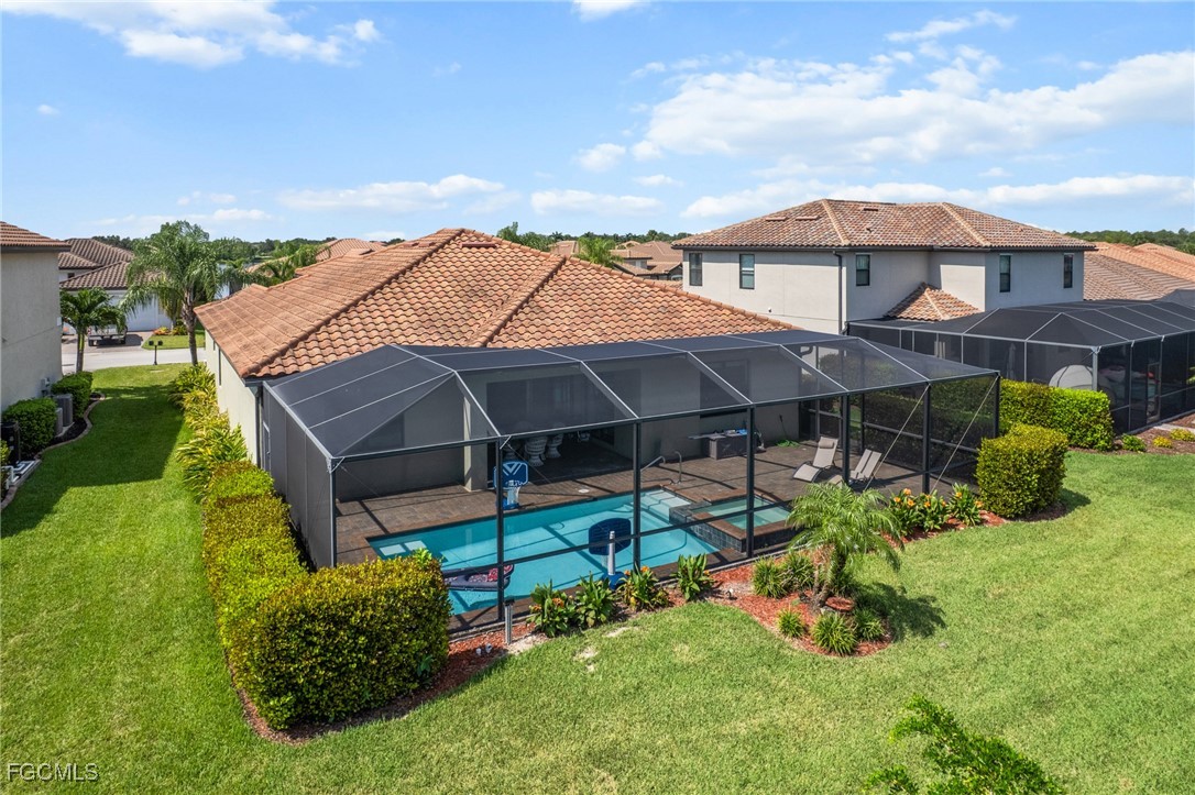 10061 Avalon Lake Circle, Unit 104 Fort Myers, FL 33913 - Photo 46 of 46 a view of a house with a yard and sitting area