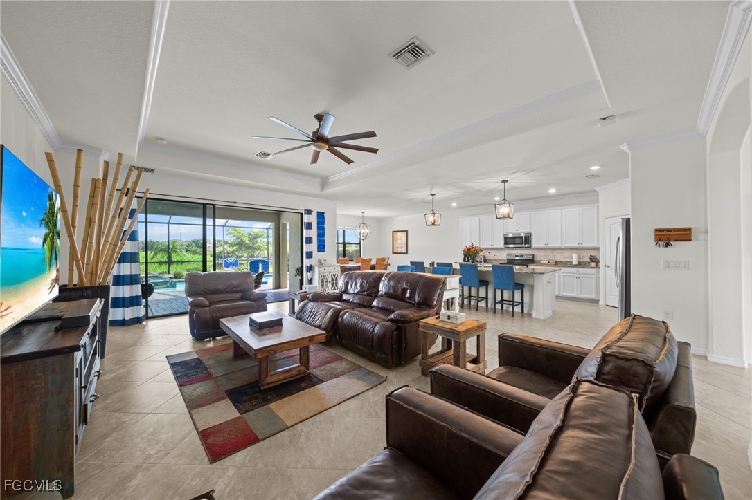 10061 Avalon Lake Circle, Unit 104 Fort Myers, FL 33913 - Photo 8 of 46 a living room with furniture kitchen view and a large window