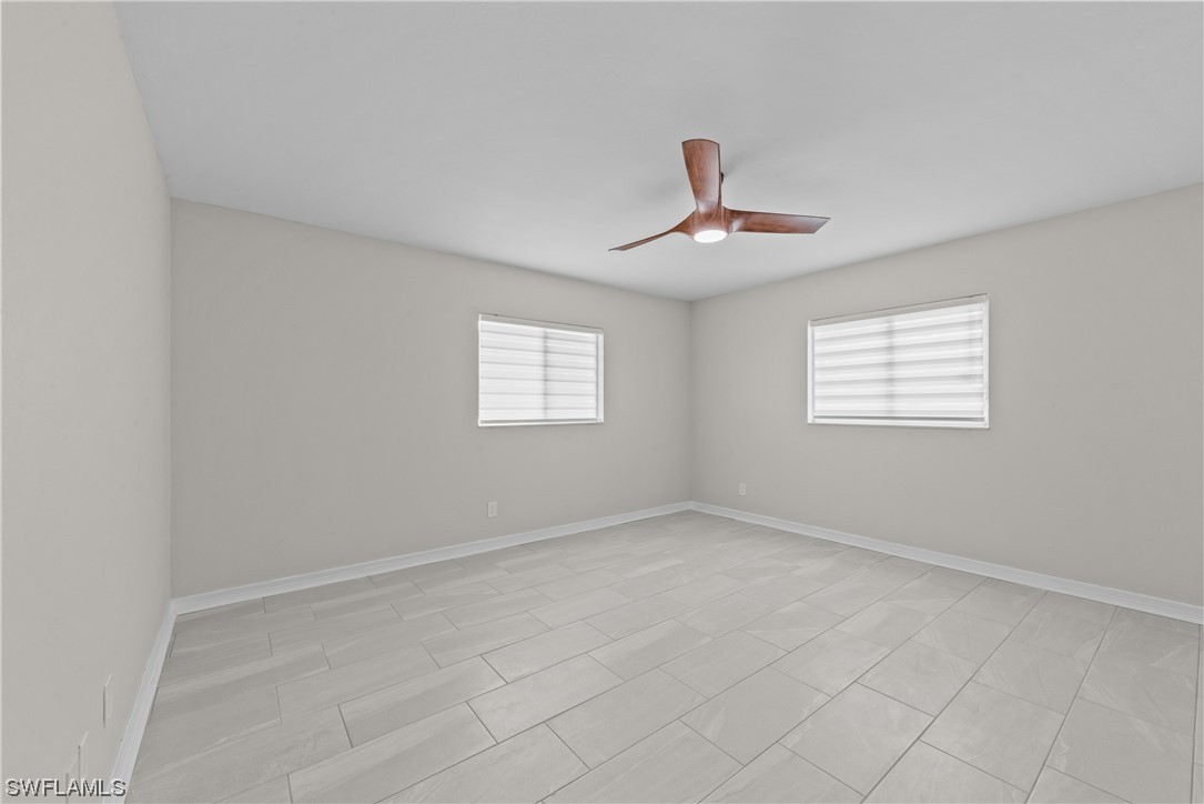 1058 Old Bridge Road North Fort Myers, FL 33917 - Photo 15 of 43 a view of an empty room with a window