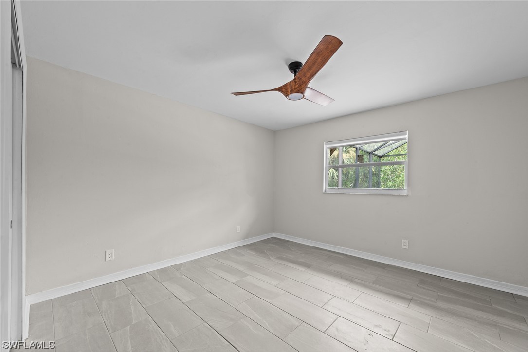 1058 Old Bridge Road North Fort Myers, FL 33917 - Photo 16 of 43 an empty room with windows