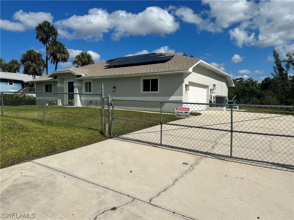 1058 Old Bridge Road North Fort Myers, FL 33917 - Photo 2 of 43 a view of a house with a yard
