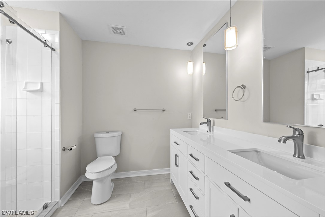 1058 Old Bridge Road North Fort Myers, FL 33917 - Photo 24 of 43 a bathroom with a sink toilet and shower