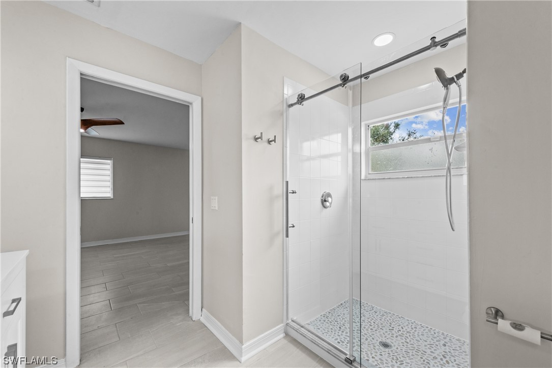 1058 Old Bridge Road North Fort Myers, FL 33917 - Photo 25 of 43 a bathroom that has a glass shower door