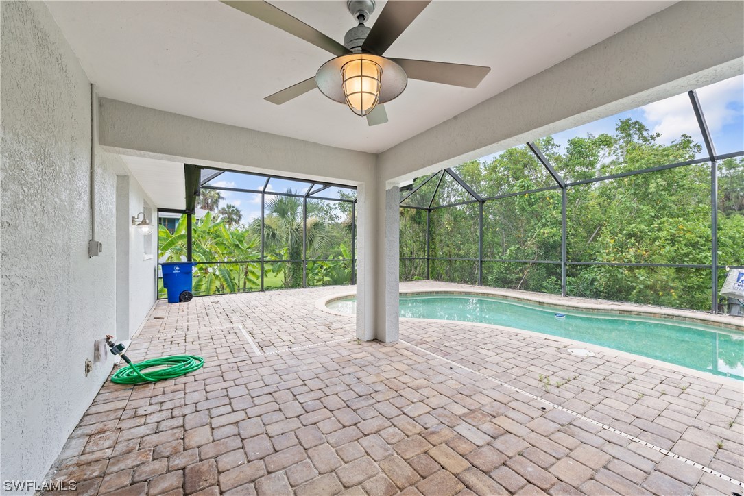 1058 Old Bridge Road North Fort Myers, FL 33917 - Photo 28 of 43 a view of empty room with floor to ceiling windows and ceiling fan