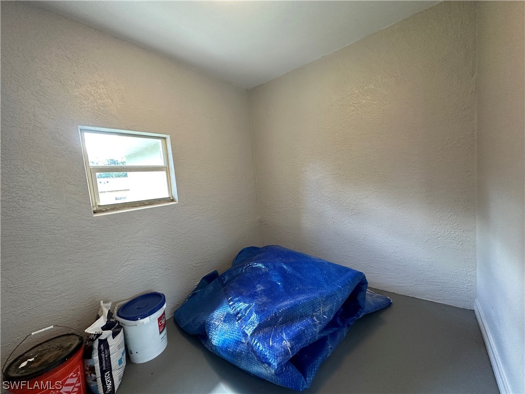 1058 Old Bridge Road North Fort Myers, FL 33917 - Photo 30 of 43 a room with a bed and a window