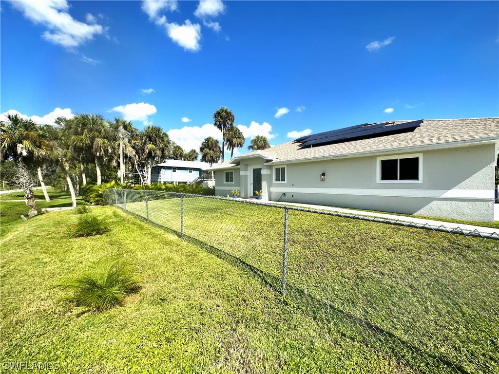 1058 Old Bridge Road North Fort Myers, FL 33917 - Photo 3 of 43 a view of a swimming pool with an outdoor space and seating area