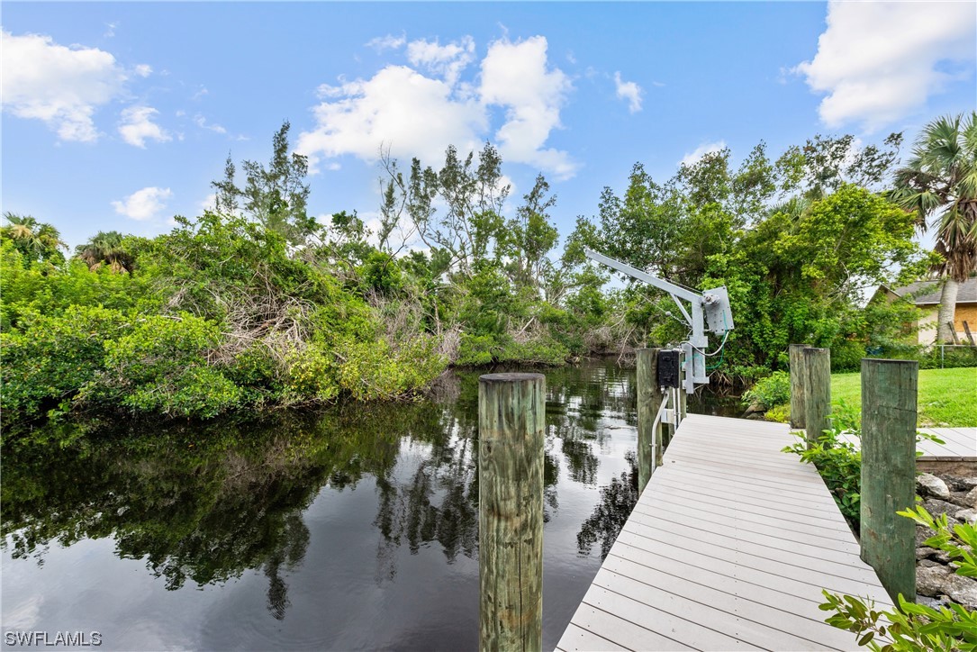 1058 Old Bridge Road North Fort Myers, FL 33917 - Photo 38 of 43 a view of a house with a yard