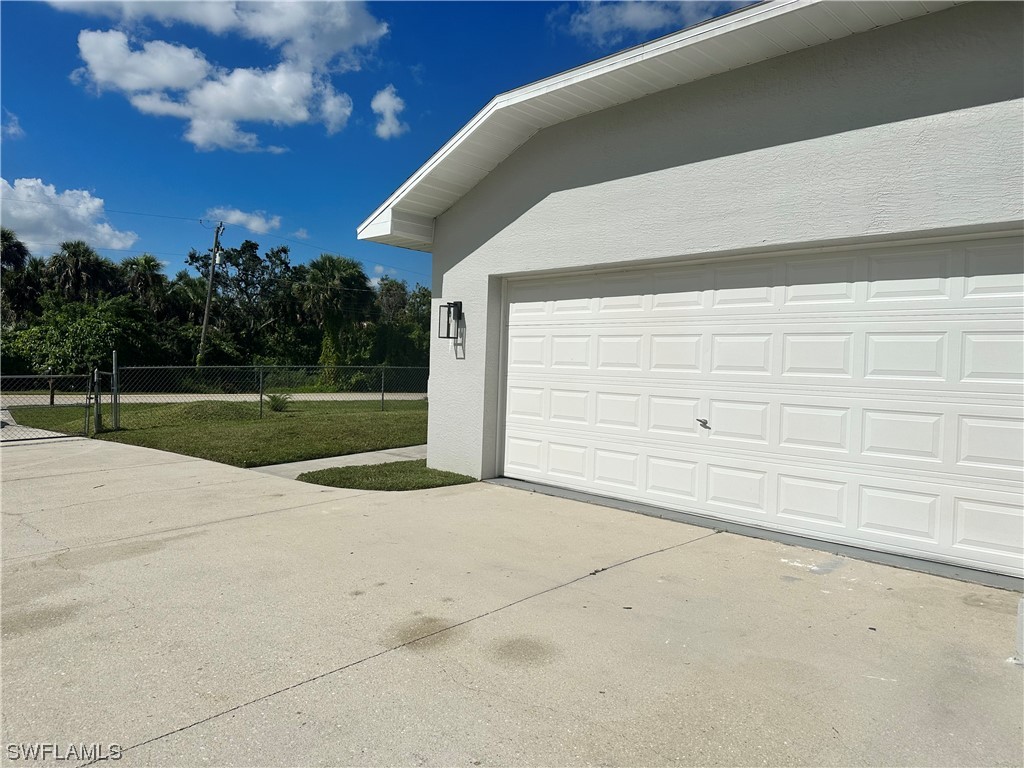 1058 Old Bridge Road North Fort Myers, FL 33917 - Photo 4 of 43 a view of backyard and tree