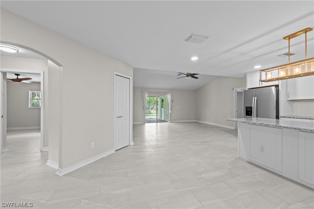 1058 Old Bridge Road North Fort Myers, FL 33917 - Photo 8 of 43 a view of a kitchen with a sink and a refrigerator