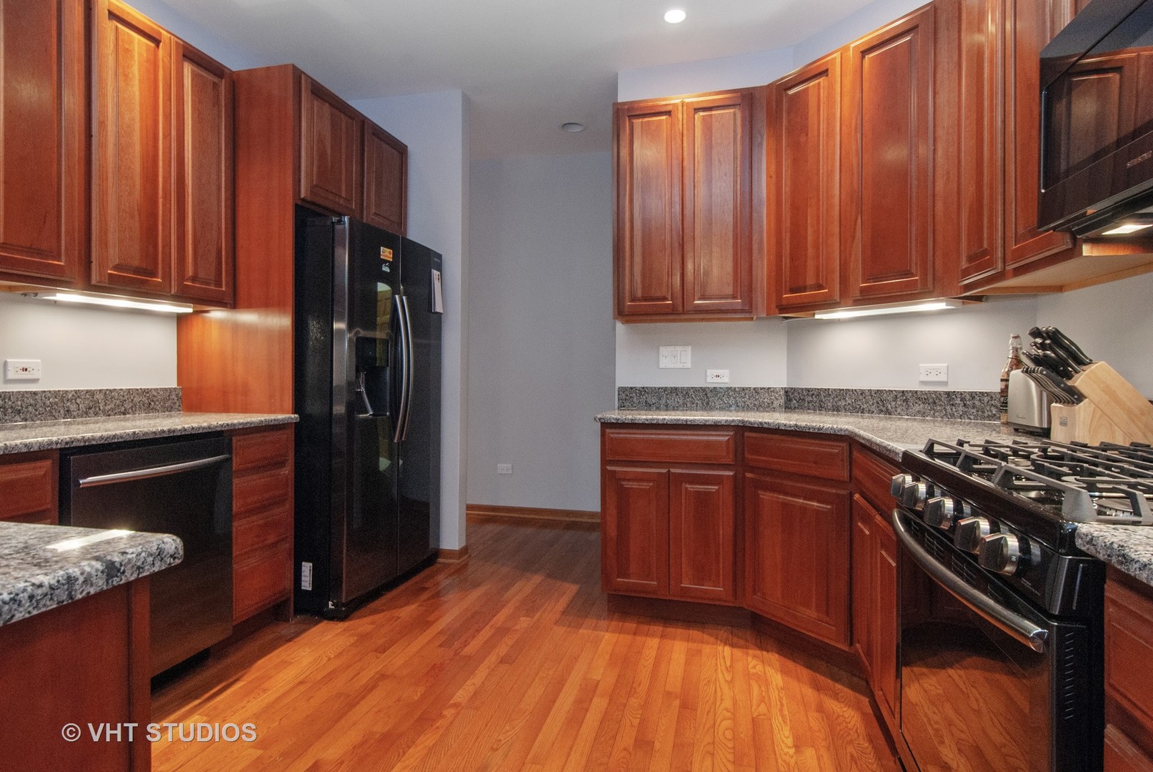 43W887 Old Midlothian Road Elburn, IL 60119 - Photo 11 of 35 a kitchen with granite countertop wooden cabinets stainless steel appliances and a sink