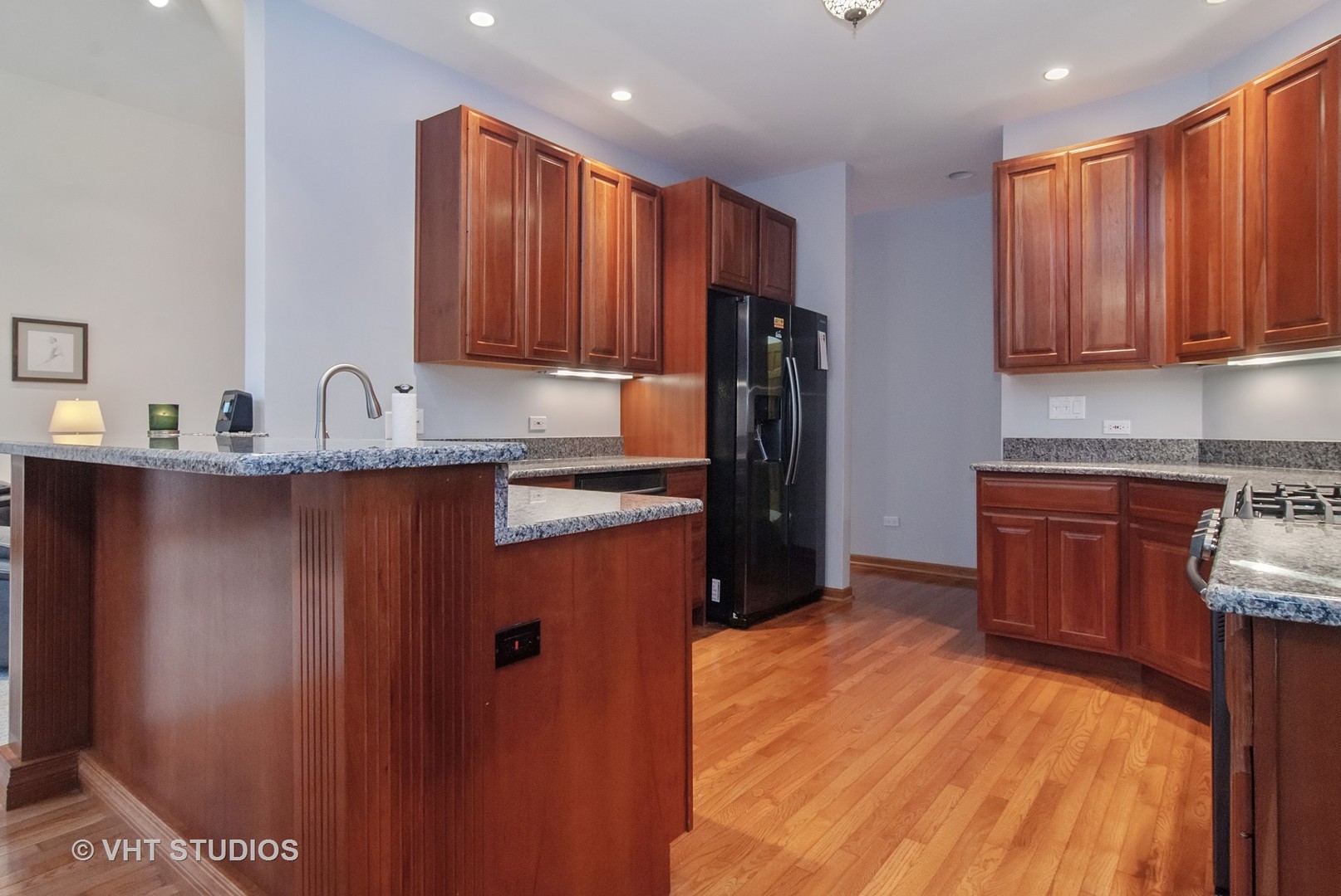 43W887 Old Midlothian Road Elburn, IL 60119 - Photo 12 of 35 a kitchen with stainless steel appliances granite countertop a refrigerator a sink dishwasher and wooden cabinets with wooden floor