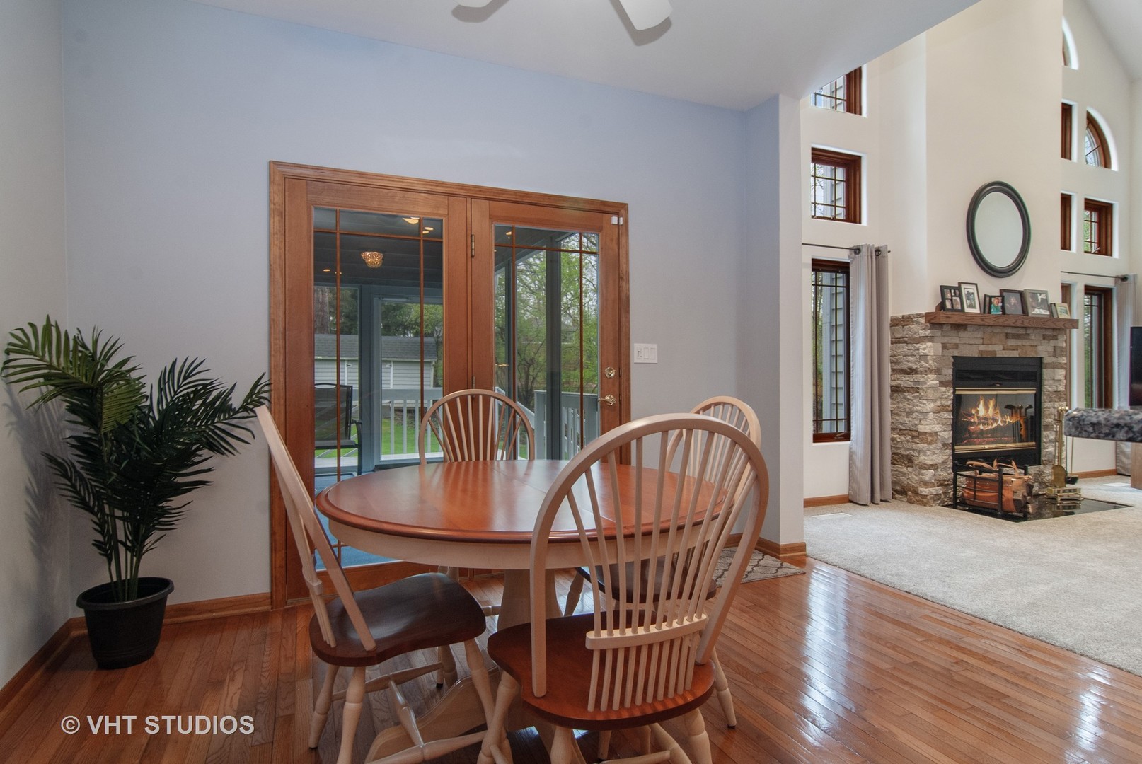 43W887 Old Midlothian Road Elburn, IL 60119 - Photo 13 of 35 a dining room with furniture garden potted plants and a fireplace