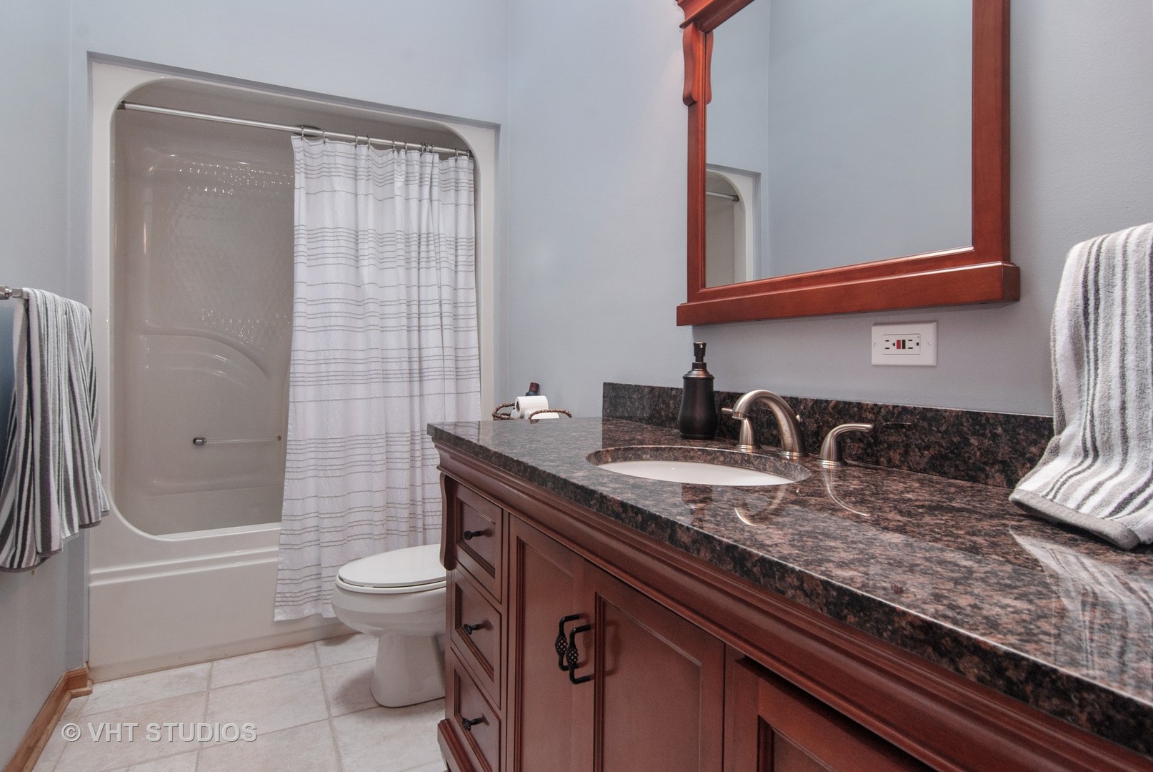 43W887 Old Midlothian Road Elburn, IL 60119 - Photo 24 of 35 a bathroom with a granite countertop toilet sink and mirror