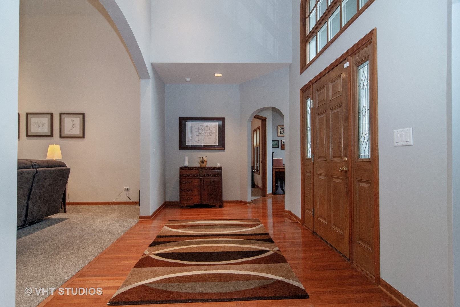 43W887 Old Midlothian Road Elburn, IL 60119 - Photo 6 of 35 a view of a hallway with wooden floor and a fireplace