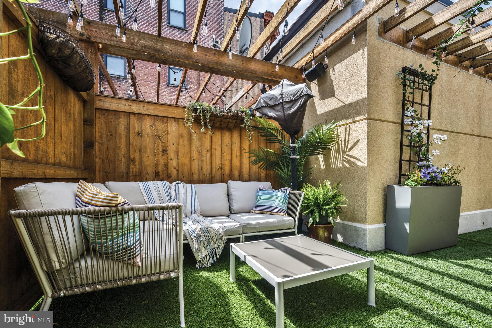 1354 Euclid Street Northwest, Unit 403A Washington, DC 20009 - Photo 19 of 26 a balcony with furniture and a potted plant