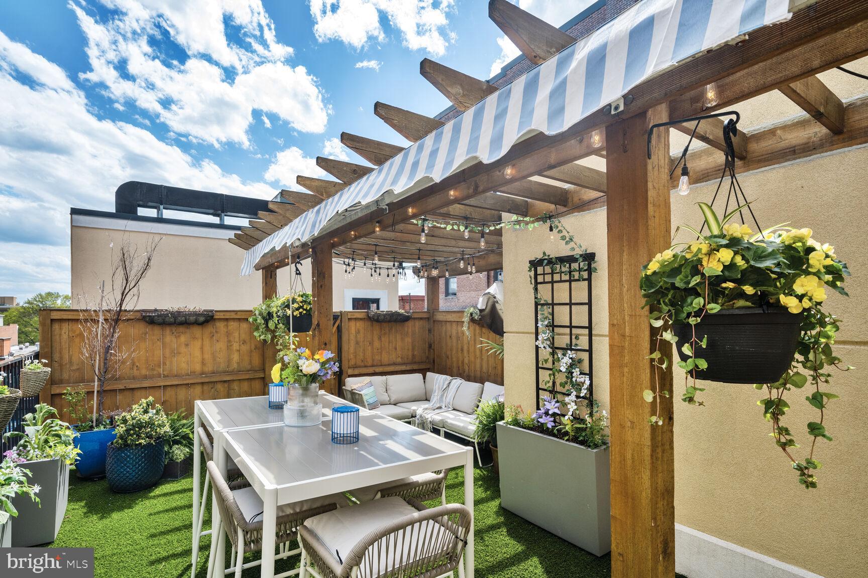 1354 Euclid Street Northwest, Unit 403A Washington, DC 20009 - Photo 2 of 26 a roof deck with couch