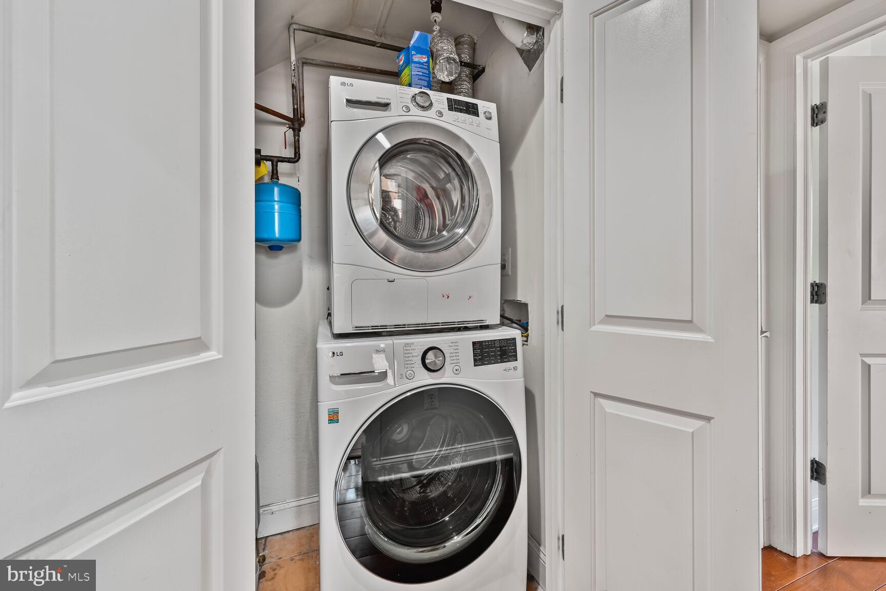 1354 Euclid Street Northwest, Unit 403A Washington, DC 20009 - Photo 21 of 26 a utility room with dryer and washer