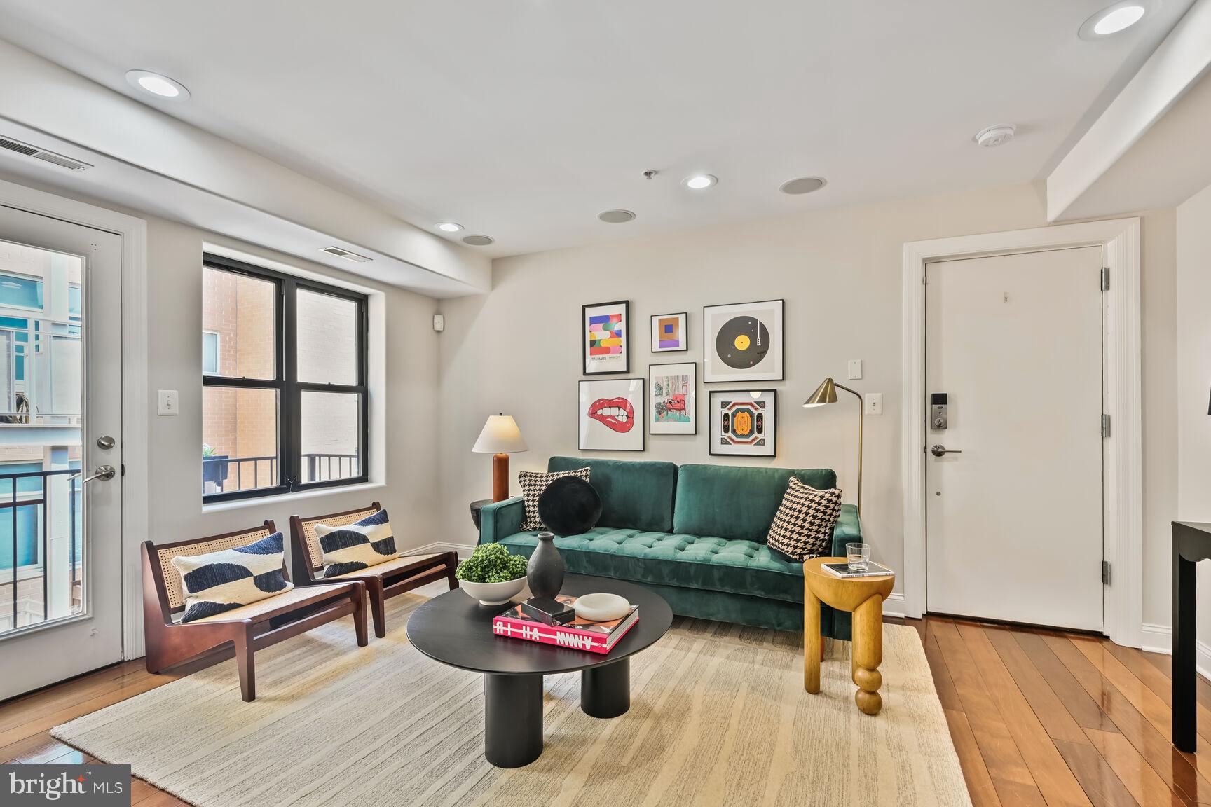 1354 Euclid Street Northwest, Unit 403A Washington, DC 20009 - Photo 3 of 26 a living room with furniture and wooden floor