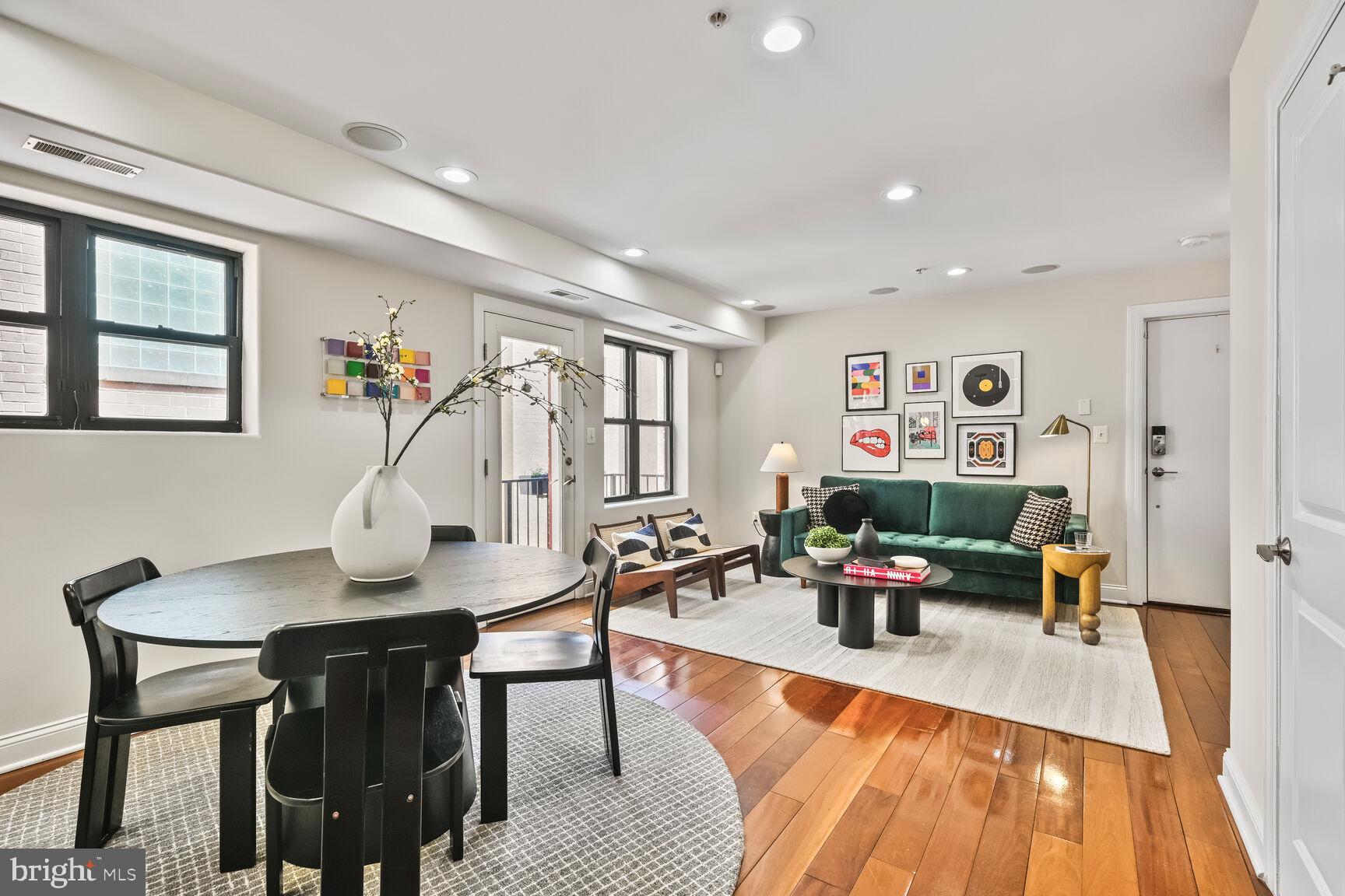 1354 Euclid Street Northwest, Unit 403A Washington, DC 20009 - Photo 5 of 26 a living room with furniture and a wooden floor