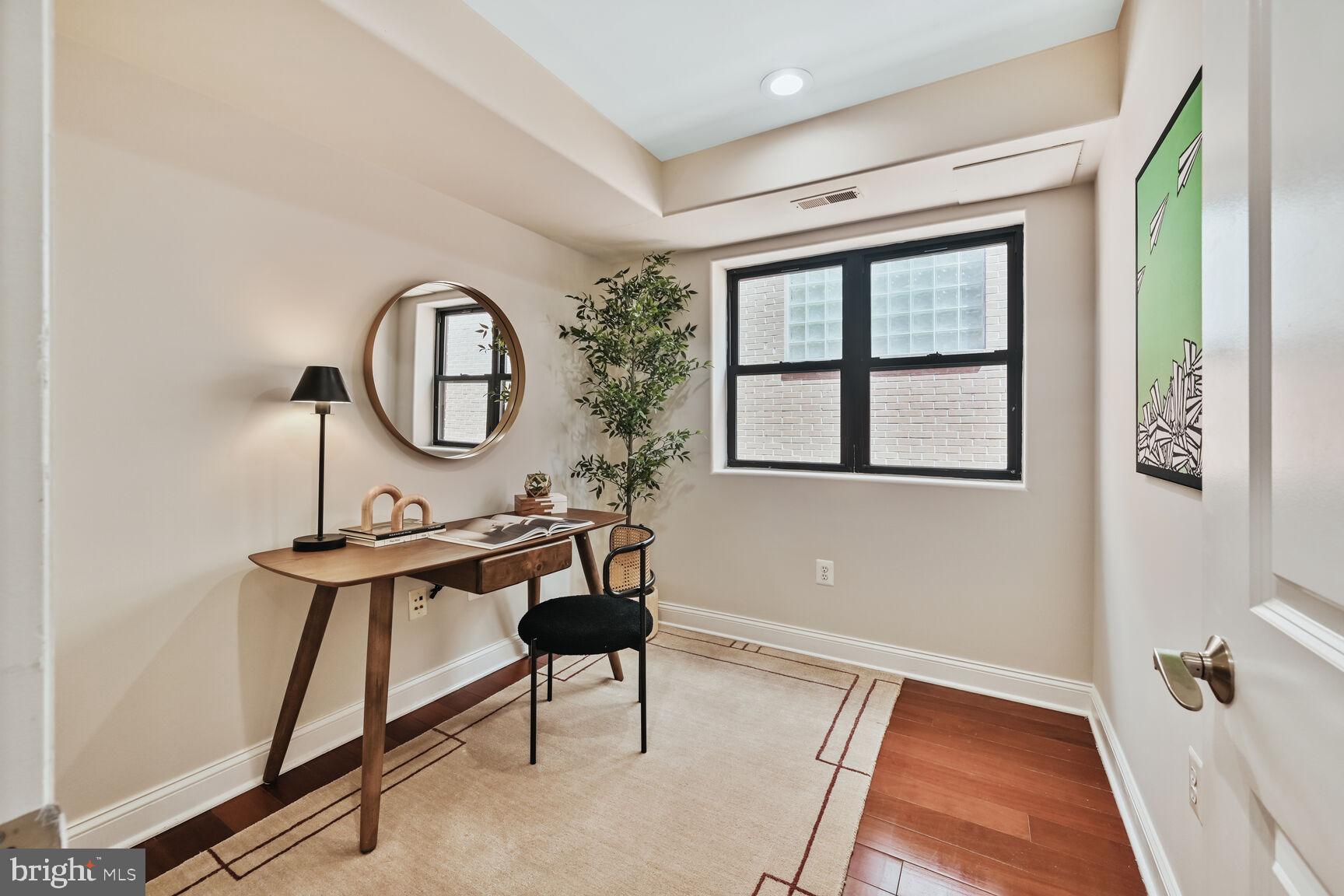 1354 Euclid Street Northwest, Unit 403A Washington, DC 20009 - Photo 10 of 26 a view of a livingroom with furniture and window